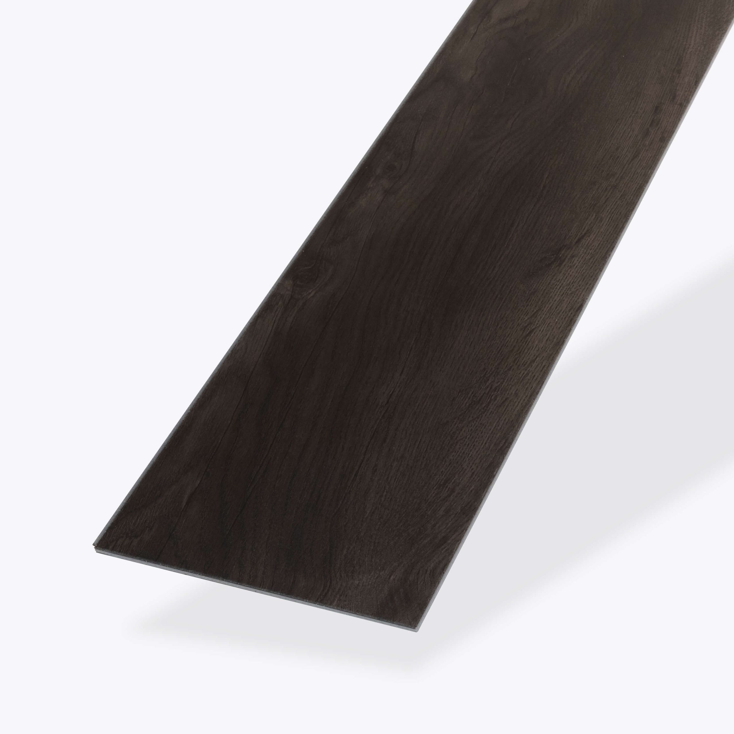 A single Cormorant* rectangular vinyl plank with a dark wood-look finish is displayed on a white background, emphasizing its smooth texture and straight edges.